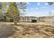 A tranquil backyard view with a pond, complemented by a wooden fence at 4850 Habersham Ln, Summerville, SC 29485