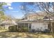 Inviting backyard featuring a screened porch, well-maintained lawn, and a home with neutral-colored siding at 4850 Habersham Ln, Summerville, SC 29485