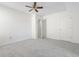 Bright bedroom featuring neutral walls, soft carpet, and ceiling fan at 4850 Habersham Ln, Summerville, SC 29485