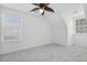 Bright bedroom featuring neutral walls, soft carpet, and two windows at 4850 Habersham Ln, Summerville, SC 29485