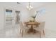 Bright dining area with french doors, a modern light fixture, and seating for four at 4850 Habersham Ln, Summerville, SC 29485
