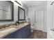 Bathroom featuring a dual sink vanity with granite countertops and modern fixtures at 5242 E Dolphin St, North Charleston, SC 29405