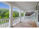 Spacious second story porch with wood flooring and a view of the surrounding neighborhood at 5242 E Dolphin St, North Charleston, SC 29405