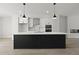 Modern kitchen with black island, stainless appliances, and white cabinetry at 564 Scholar Way, Summerville, SC 29486