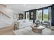 Bright and modern living room with neutral tones, comfortable seating, stylish decor and staircase at 568 Scholar Way, Summerville, SC 29486