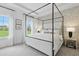 Serene bedroom with a four-poster bed, natural light, and calming decor for a peaceful retreat at 568 Scholar Way, Summerville, SC 29486