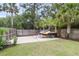 Spacious backyard with privacy fence, concrete pad, and lush landscaping, perfect for outdoor activities at 591 Two Mile, Johns Island, SC 29455