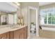 Bathroom features a soaking tub, vanity, and tile flooring at 591 Two Mile, Johns Island, SC 29455
