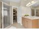 Bathroom with glass shower, vanity, and open doorway to a walk-in closet at 591 Two Mile, Johns Island, SC 29455