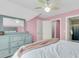 Spacious bedroom with pink walls, natural light, and elegant furniture, creating a cozy and inviting atmosphere at 591 Two Mile, Johns Island, SC 29455