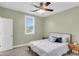 Serene bedroom with a ceiling fan, natural light, and calming green walls, creating a cozy and relaxing retreat at 591 Two Mile, Johns Island, SC 29455