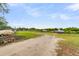 Expansive outdoor boat storage area featuring grass and gravel, providing ample space for boat and trailer parking at 591 Two Mile, Johns Island, SC 29455
