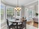 A breakfast nook features a bay window providing natural light and wood table at 591 Two Mile, Johns Island, SC 29455