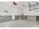 Clean, spacious garage interior with white walls, concrete floor, and stairs leading to additional space at 591 Two Mile, Johns Island, SC 29455