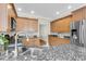A kitchen with stainless steel appliances, wood cabinets, and a granite countertop island at 591 Two Mile, Johns Island, SC 29455