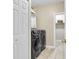 Well-equipped laundry room with modern washer and dryer and ample storage, providing convenience and efficiency at 591 Two Mile, Johns Island, SC 29455