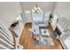 Open-concept living room with hardwood floors, fireplace, and large windows, creating a bright and inviting space at 591 Two Mile, Johns Island, SC 29455
