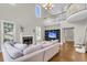 Inviting living room featuring hardwood floors, a fireplace, and a comfortable seating area with natural light at 591 Two Mile, Johns Island, SC 29455