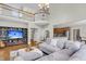 Expansive living area with soaring ceilings, a fireplace, hardwood floors, and open access to the kitchen at 591 Two Mile, Johns Island, SC 29455