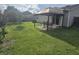 Lush backyard with patio area and table, perfect for outdoor dining and relaxation at 605 Grassy Hill Rd, Summerville, SC 29483