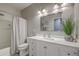 Well-lit bathroom featuring a vanity with a white countertop and shower with glass door at 605 Grassy Hill Rd, Summerville, SC 29483