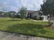 Charming single-story home with well-manicured lawn, flowerbeds, and walkway leading to the front door at 605 Grassy Hill Rd, Summerville, SC 29483