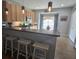Well-lit kitchen featuring a breakfast bar with stools, pendant lighting, and stainless steel appliances at 605 Grassy Hill Rd, Summerville, SC 29483