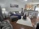 Inviting living room with hardwood floors, a comfortable sectional sofa, and stylish decor at 605 Grassy Hill Rd, Summerville, SC 29483