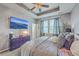 Large bedroom with a decorative ceiling fan, large television and neutral decor at 605 Grassy Hill Rd, Summerville, SC 29483