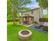Spacious backyard with a gazebo, fire pit, and comfortable seating area at 708 Professor Dr, Ladson, SC 29456