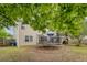 Spacious backyard featuring a trampoline, gazebo, and well-maintained lawn perfect for outdoor activities and entertaining guests at 708 Professor Dr, Ladson, SC 29456