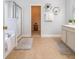 Well-lit bathroom with tub, shower, and modern fixtures leading to closet is a comfortable space at 708 Professor Dr, Ladson, SC 29456