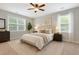 Serene bedroom with neutral colors, plush rug, and ample natural light creates a relaxing retreat at 708 Professor Dr, Ladson, SC 29456