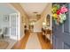 Welcoming entryway with hardwood floors and a floral wreath on the door at 708 Professor Dr, Ladson, SC 29456