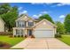 Charming two-story home with a well-manicured lawn and blue shutters at 708 Professor Dr, Ladson, SC 29456