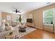 Inviting living room with hardwood floors, neutral walls, and plenty of natural light at 708 Professor Dr, Ladson, SC 29456