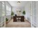 Bright home office with a desk, chair, and plenty of natural light at 708 Professor Dr, Ladson, SC 29456