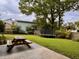 Spacious backyard featuring a trampoline and picnic table on a grassy lawn at 8 Brisbane Dr, Charleston, SC 29407