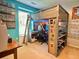Unique bedroom featuring a loft bed, a built-in desk area, and shelving, maximizing space for a functional living area at 8 Brisbane Dr, Charleston, SC 29407