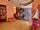 Whimsical bedroom with colorful decor, a variety of plush toys, and ample space for play, creating a fun environment at 8 Brisbane Dr, Charleston, SC 29407