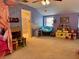 Spacious bedroom with playful decor, a comfortable seating area, and ample space for play, perfect for a retreat at 8 Brisbane Dr, Charleston, SC 29407