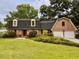 Charming brick home with well-manicured lawn and attached two-car garage, plus mature trees at 8 Brisbane Dr, Charleston, SC 29407