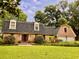 Charming brick home featuring a well-maintained lawn, mature landscaping, and inviting curb appeal at 8 Brisbane Dr, Charleston, SC 29407