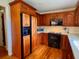Kitchen with dark appliances, wooden cabinets, and hardwood flooring at 8 Brisbane Dr, Charleston, SC 29407