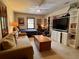 Comfortable living area featuring a couch, large TV, and built-in shelving for an inviting space at 8 Brisbane Dr, Charleston, SC 29407
