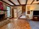 Bright living room with brick fireplace and access to stairway at 8 Brisbane Dr, Charleston, SC 29407