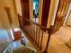 Staircase offering a view of the entryway, featuring tiled flooring and a wooden front door, creating a welcoming entrance at 8 Brisbane Dr, Charleston, SC 29407