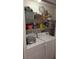 Laundry room includes washer, dryer, and storage shelves for organizing supplies at 806 Greenmeadow Dr, Goose Creek, SC 29445
