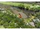 Stunning aerial view of property showcasing lush landscaping, marsh views, and access to the golf course at 811 Treeloft Trce, Seabrook Island, SC 29455