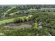 Expansive aerial view showcasing the neighborhood's lush landscape and proximity to the golf course at 811 Treeloft Trce, Seabrook Island, SC 29455